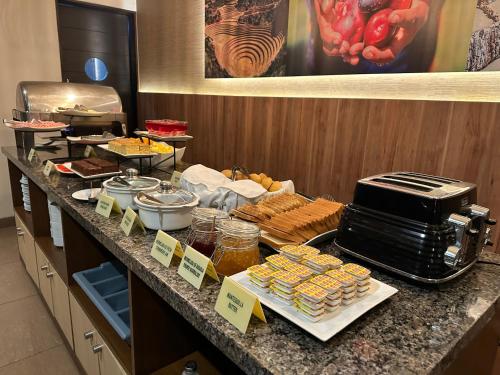 a buffet of food on a counter in a restaurant at El Tambo 1 in Lima
