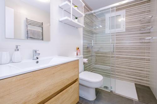 a bathroom with a toilet and a sink and a shower at Samaniego ID175 in Orihuela Costa