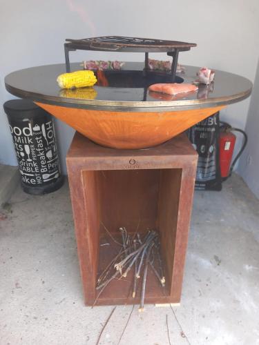 a wooden bowl on top of a table at Villa in Sintra - Casa da Penha Ferrim in Sintra