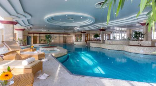 a large swimming pool in a hotel lobby at Slieve Russell Hotel in Ballyconnell