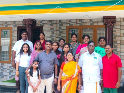 a group of people standing in front of a building at Arabian Nights Munnar Pool Villa in Munnar
