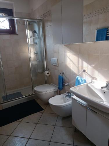 a bathroom with a shower and a toilet and a sink at Il Nido Rosso in Foligno