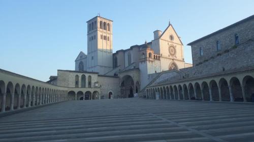 a large building with a clock tower in the distance at Il Nido Rosso in Foligno