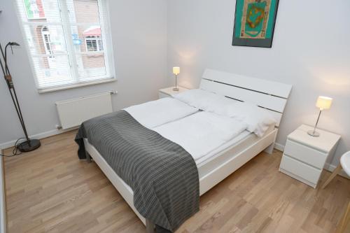 En eller flere senger på et rom på Sønderborg City Apartments