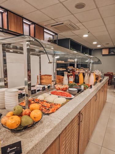 a buffet line with many different types of food at ibis Rio de Janeiro Centro in Rio de Janeiro