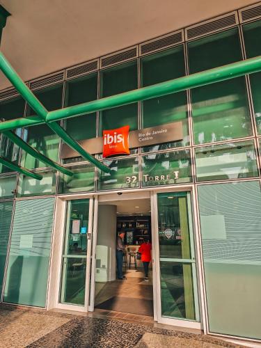 an entrance to a large building with people walking into it at ibis Rio de Janeiro Centro in Rio de Janeiro