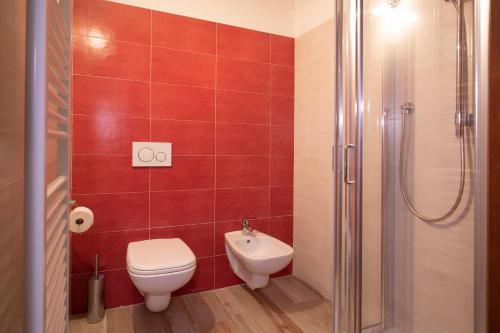 a bathroom with a toilet and a sink and a shower at Maison Croix de Ville in Aosta
