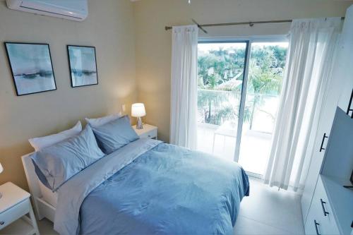 Postel nebo postele na pokoji v ubytování Villa 213, Residencial Boca Paraíso