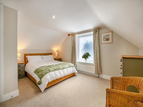 a bedroom with a bed and a window at The Wheelhouse in Liverton