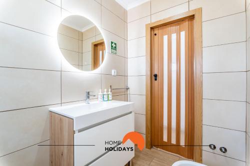 a bathroom with a sink and a mirror at #179 Wide Backyard in Countryside in Albufeira