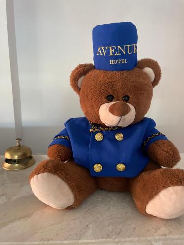 a teddy bear with a hat on its head at Hotel AVENUE in Ravda