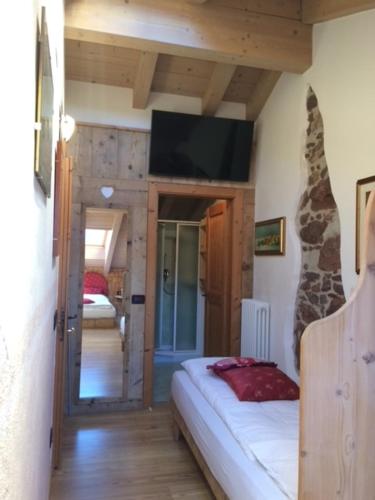 Postel nebo postele na pokoji v ubytování Hotel Garnì Salvanel