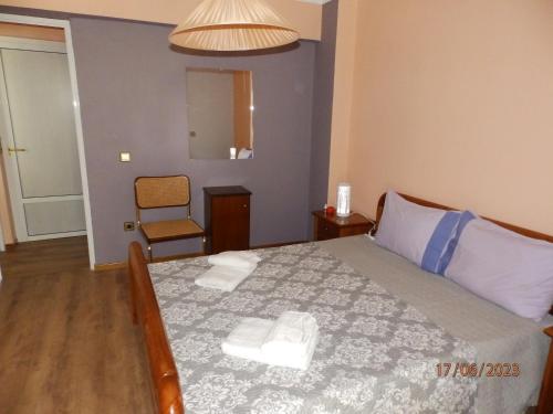 Ένα ή περισσότερα κρεβάτια σε δωμάτιο στο Muses apartments