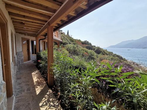 a house with a view of the water at Peninsula Gardens Hotel in Kas
