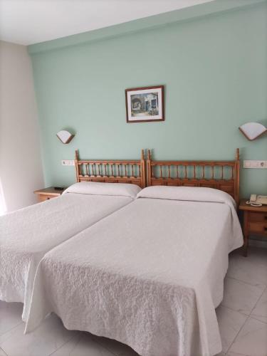 Кровать или кровати в номере Hotel Bonaire