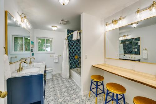 a bathroom with a sink and two stools at Private Beachfront Lake Michigan Rental with Kayaks in Pentwater
