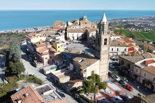 an aerial view of a town with a clock tower at DaVi' casa vacanze. Un sogno immerso nel verde ! in Montepagano
