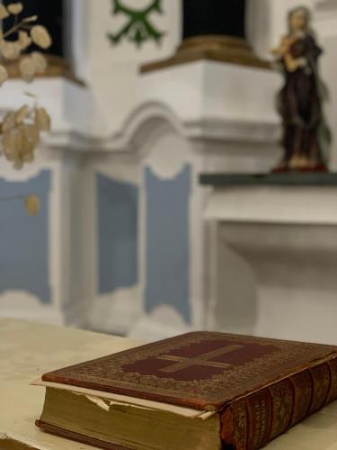 an old book sitting on top of a table at Change The World - Solar de Alvega in Alvega