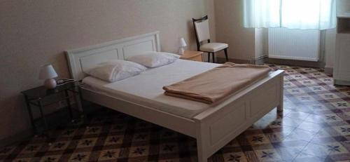 Postel nebo postele na pokoji v ubytování Gîte les Arcades