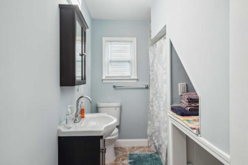 a bathroom with a sink and a shower at Pet-Friendly Mount Rainier Home with Gas Grill! in Mount Rainier