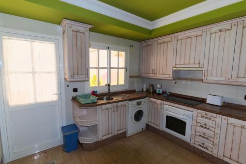 A kitchen or kitchenette at Casa Sagittarius Ocean view