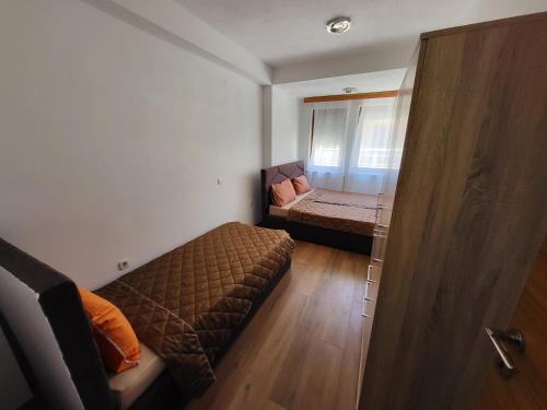 Ένα ή περισσότερα κρεβάτια σε δωμάτιο στο Eva apartment