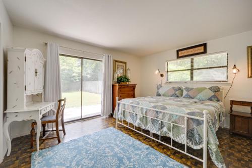 a bedroom with a bed and a desk and a window at McQueeney Home with Grill about 10 Mi to New Braunfels in McQueeney