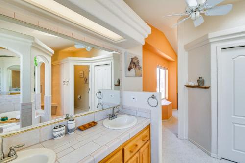 a bathroom with two sinks and a large mirror at Lake Havasu City Vacation Rental with Private Pool! in Lake Havasu City