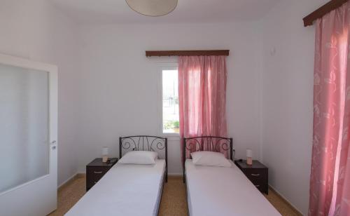 Postel nebo postele na pokoji v ubytování Classic Guesthouse Nafplion
