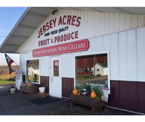 a store with a sign that readsergy acres fruit and produce at Pine Grove Scenic View Unforgettable Love Getaway in Pine Grove