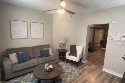 a living room with a couch and a table at Cozy Portsmouth Retreat 2BR 1BA in Portsmouth