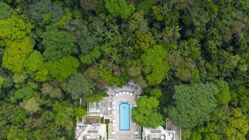 an overhead view of a building in the middle of a forest at Palácio Tangará, Oetker Hotels in Sao Paulo