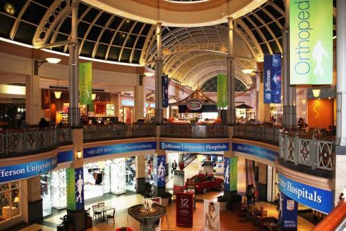 a large shopping mall with a lot of stores at 5 Star Penthouse King Deck AC Train in Narberth
