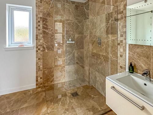 a bathroom with a shower and a sink at Lurach House - Ukc6791 in Port Appin