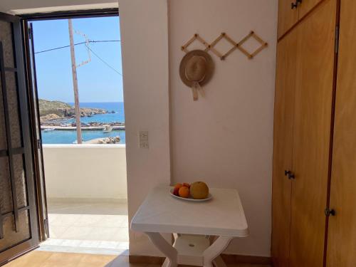 a bowl of fruit on a table in a room at Coastal Charm - Sea View Room in Elíka