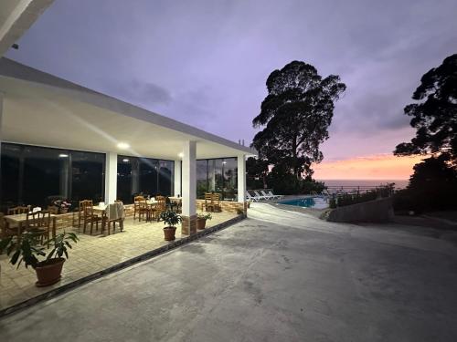 a house with a patio with a view of the ocean at Zuri Kvariati in Kvariati