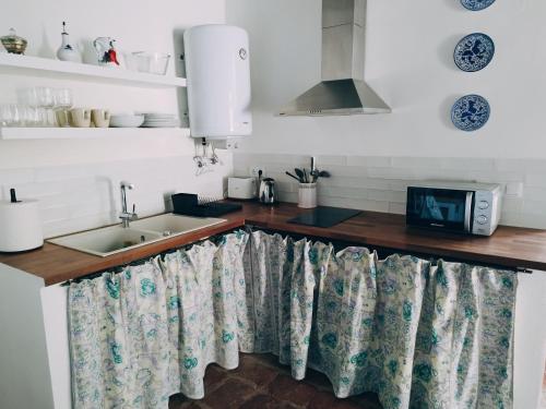 a kitchen with a sink and a counter top at Casimiro Alojamiento Rural in Guadalupe