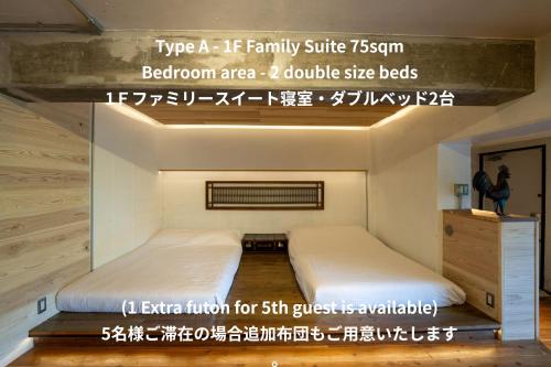 a small bedroom with two beds in it at SPRINGS VILLAGE HAKONE Glamping Resort in Hakone