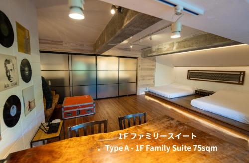 a bedroom with a bed and a table in a room at SPRINGS VILLAGE HAKONE Glamping Resort in Hakone
