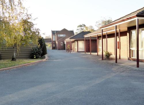 an empty street in front of some buildings at Victoriana Motor Inn in Ballarat