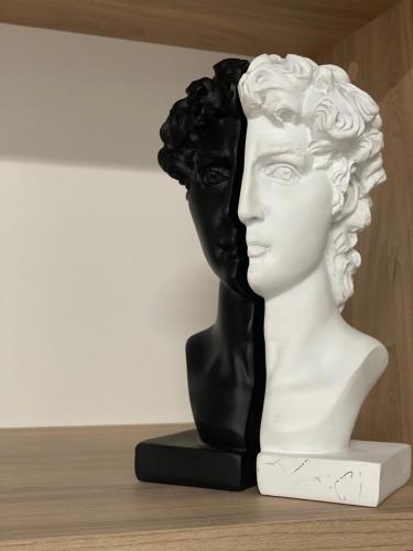a statue of a bust sitting on a shelf at Hotel AVENUE in Ravda