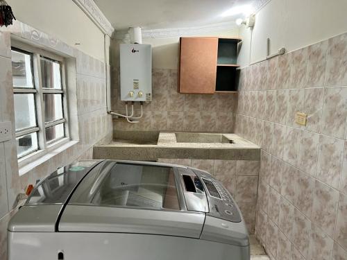 a car parked in a room with a kitchen at Tucan Hostal in Circasia