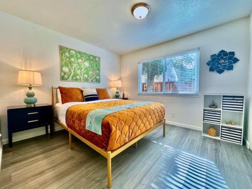 a bedroom with a bed and a window at First floor gated, central and remodeled apartment in Sacramento