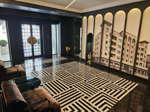 a living room with a lobby with a geometric floor at Rosetti One in Constanţa