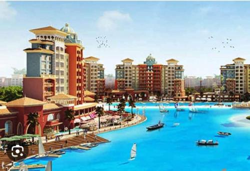 a rendering of a city with blue water and buildings at استديو فى بورتو جولف مارينا in El Alamein