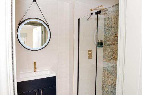 a bathroom with a sink and a mirror at The Flag in Wivenhoe