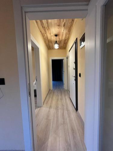 a hallway in a house with a wood ceiling at Noğa Suit Apart in Pazar