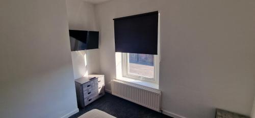 APARTMENT IN CENTRAL BARNSLEYにあるテレビまたはエンターテインメントセンター
