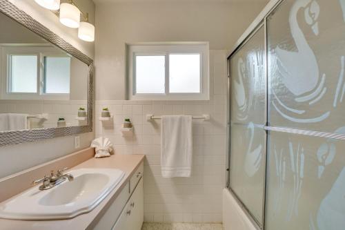 a bathroom with a sink and a shower at Luxe Waterfront Oasis with Dock - Direct Lake Access! in Tavares