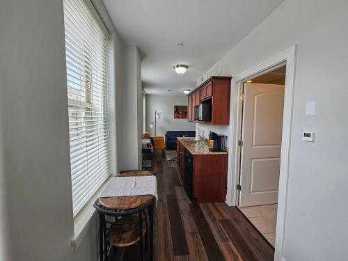 a kitchen with a counter and a table in a room at Gorgeous and Spacious Studio at the Historic Inman - 200 in Champaign